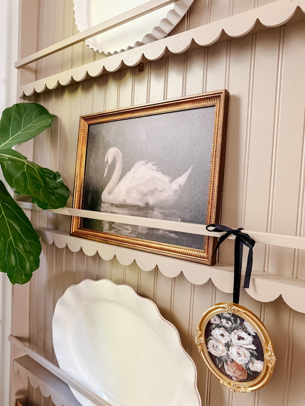 Create a charming and functional DIY plate rack wall with scallop molding in your kitchen, using simple materials and a step-by-step guide!