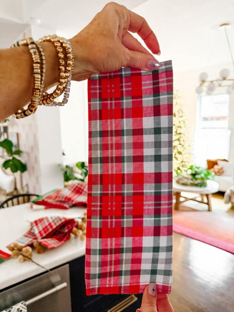 Make an Easy Giant Christmas Bow. Turn inexpensive table runners into a show-stopping giant Christmas bow with this easy step-by-step tutorial.