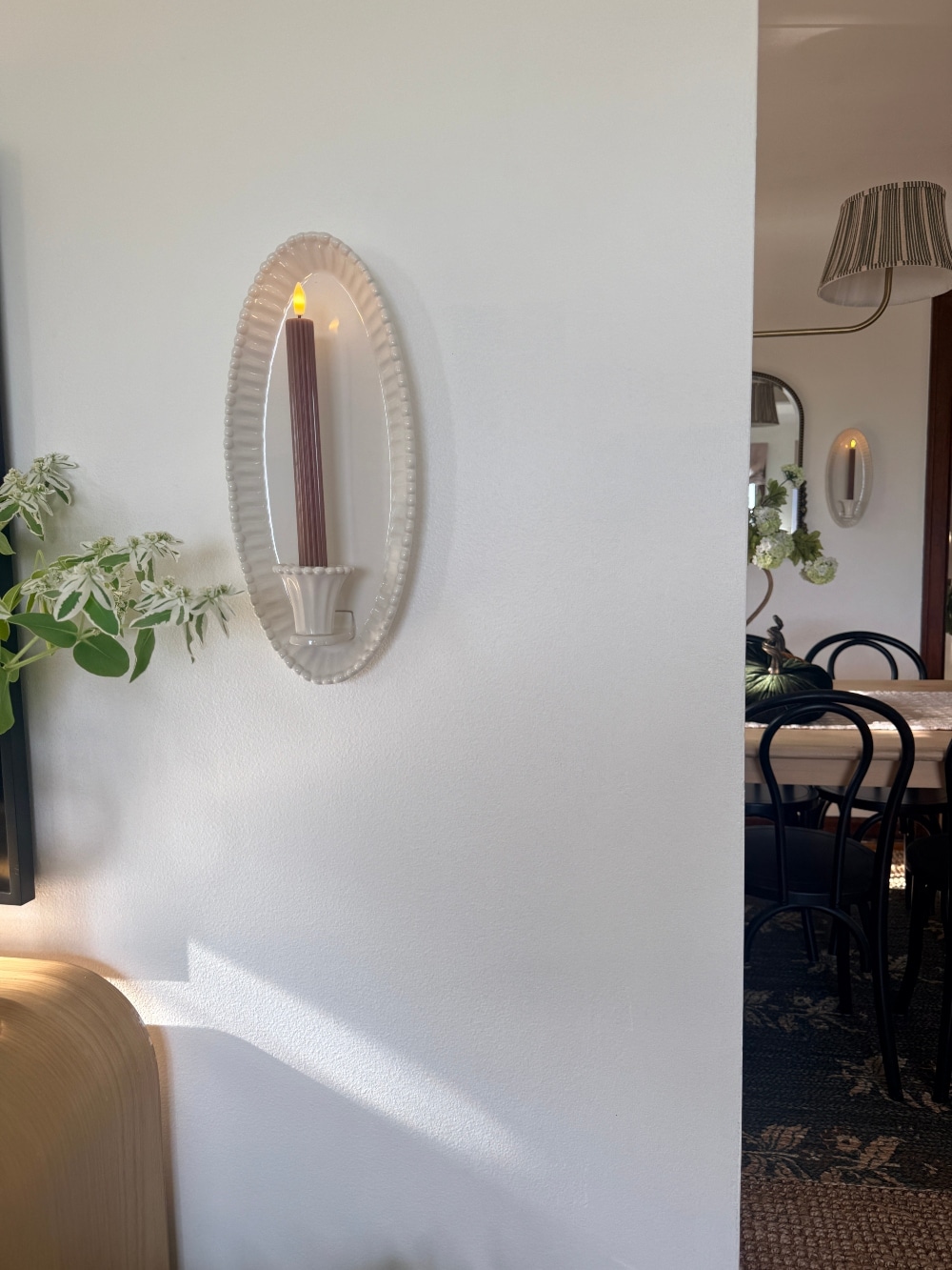 $30 Ceramic Candle Wall Sconces That Look Like Designer Lighting. Create the cozy glow of designer lighting with affordable ceramic candle wall sconces and realistic flameless taper candles.