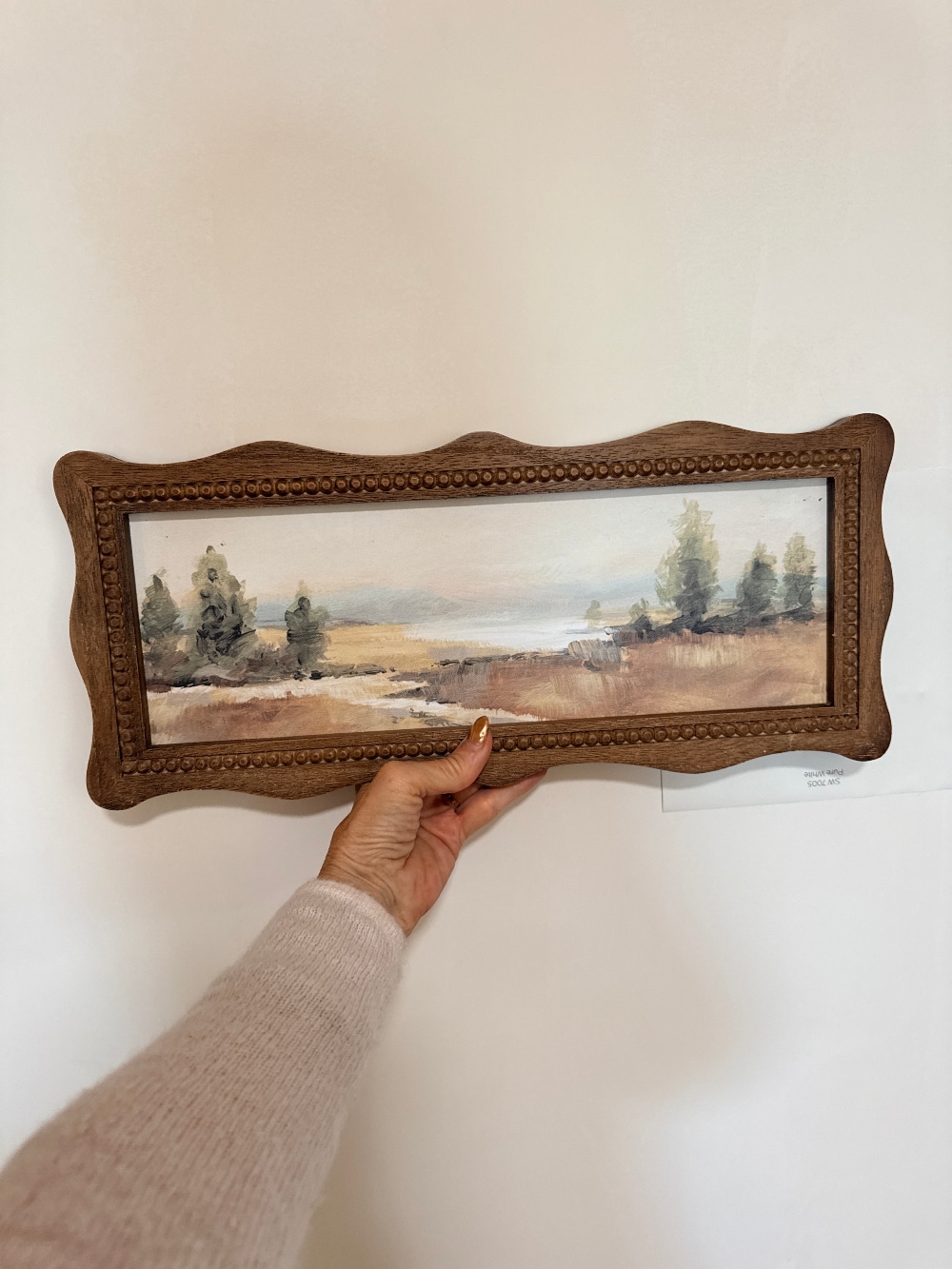 How to Create a Beautiful Gallery Wall Using a Butcher Paper Template. Create a beautifully collected gallery wall with perfect spacing using this easy butcher paper template method, plus a clever way to disguise an awkward light switch.
