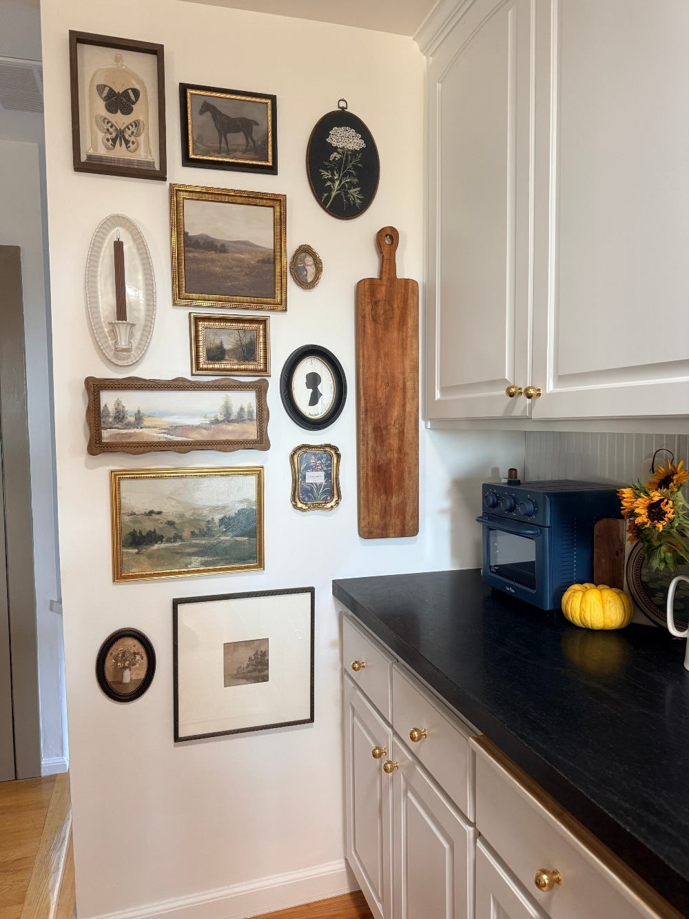How to Create a Beautiful Gallery Wall Using a Butcher Paper Template. Create a beautifully collected gallery wall with perfect spacing using this easy butcher paper template method, plus a clever way to disguise an awkward light switch.