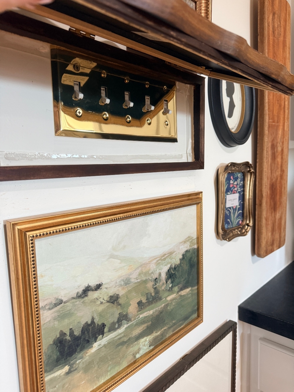 How to Create a Beautiful Gallery Wall Using a Butcher Paper Template. Create a beautifully collected gallery wall with perfect spacing using this easy butcher paper template method, plus a clever way to disguise an awkward light switch.
