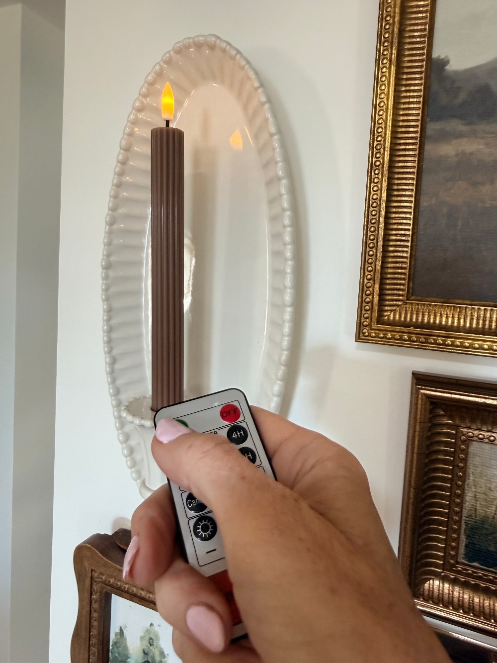 How to Create a Beautiful Gallery Wall Using a Butcher Paper Template. Create a beautifully collected gallery wall with perfect spacing using this easy butcher paper template method, plus a clever way to disguise an awkward light switch.