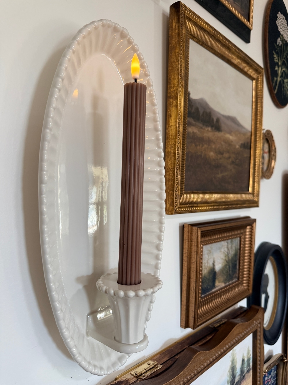 How to Create a Beautiful Gallery Wall Using a Butcher Paper Template. Create a beautifully collected gallery wall with perfect spacing using this easy butcher paper template method, plus a clever way to disguise an awkward light switch.