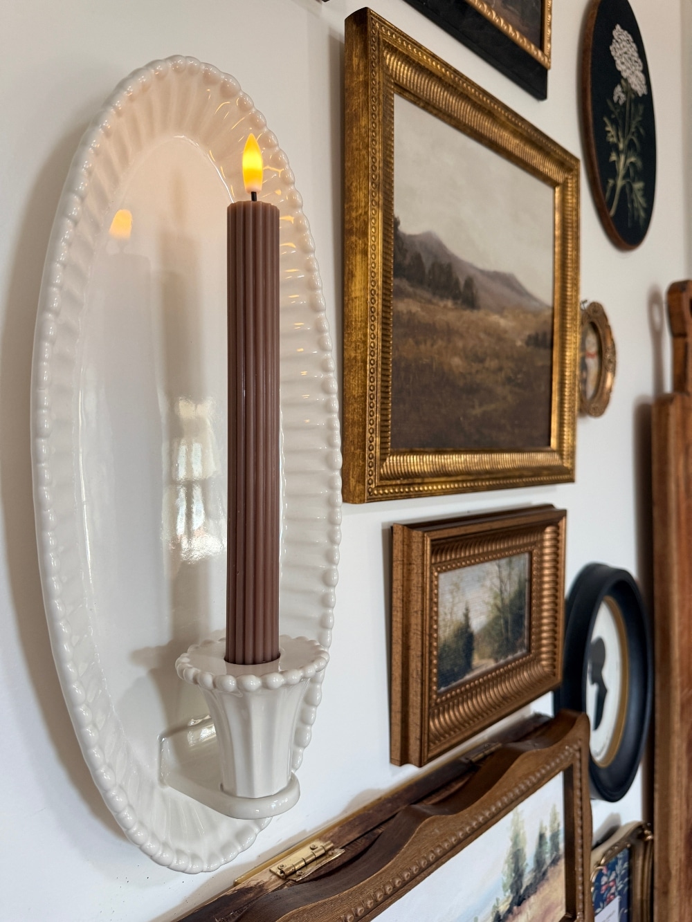 How to Create a Beautiful Gallery Wall Using a Butcher Paper Template. Create a beautifully collected gallery wall with perfect spacing using this easy butcher paper template method, plus a clever way to disguise an awkward light switch.