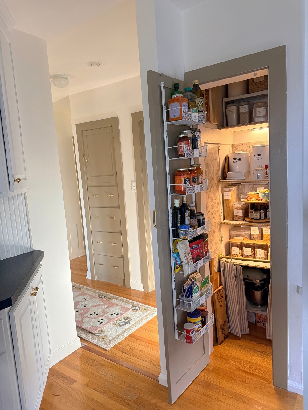 This tiny pantry makeover proves that you don’t need a huge space to create beautiful, functional storage. I transformed the original pantry in my 1932 Tudor with smart storage solutions, wallpaper, pretty containers, a baking station, appliance storage, and vintage-inspired details that make every inch work harder.